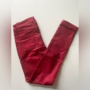Coated skinny jeans in red. Size LARGE.